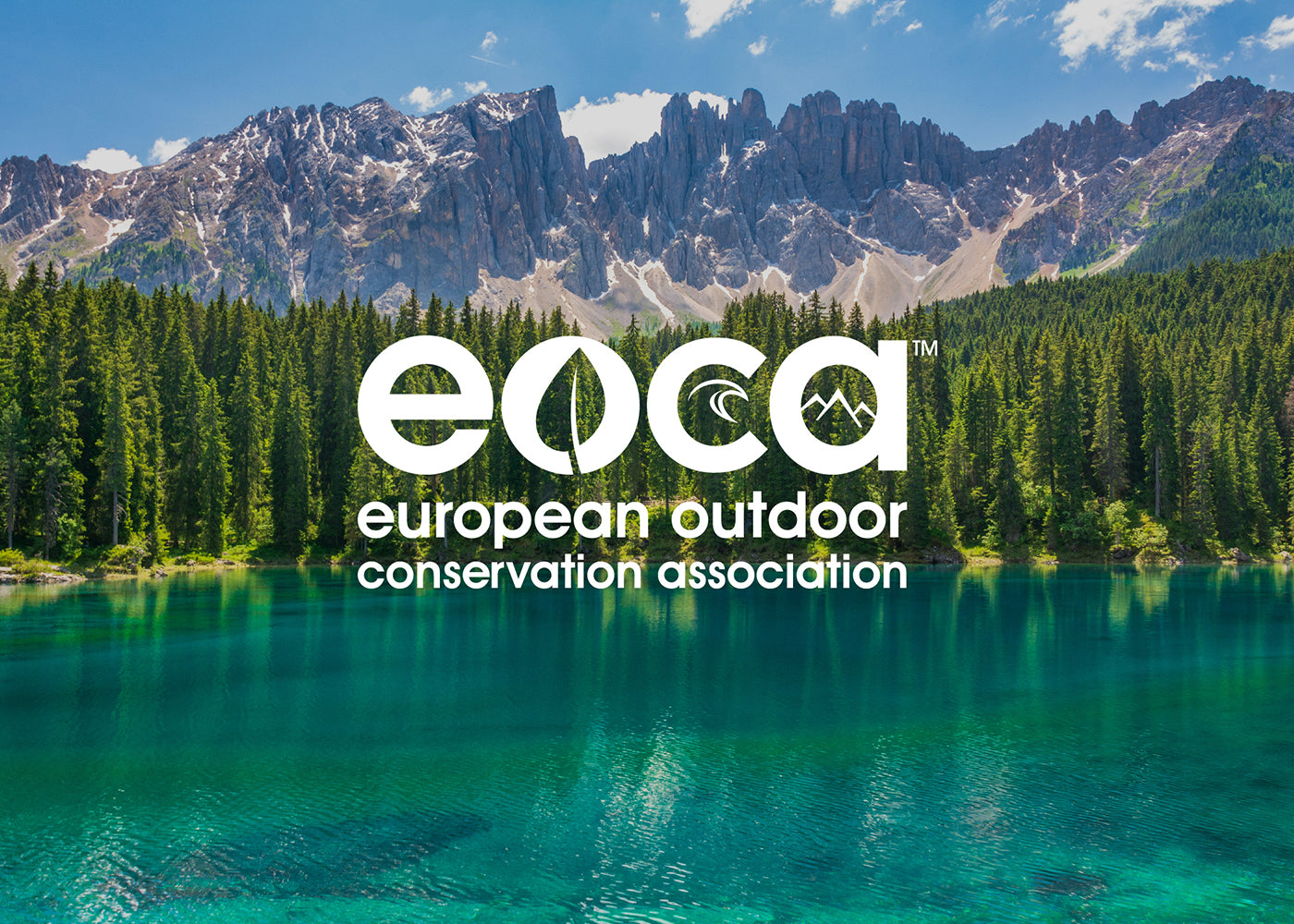 A "European Outdoor Conservation Association" logo overlayed on a photo of a lake with trees and mountains in the background.