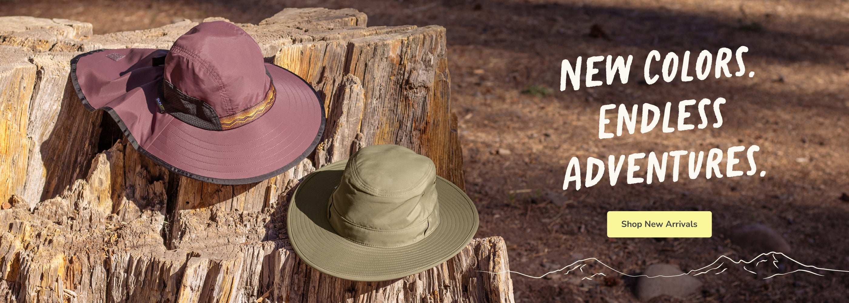 Two wide-brim sun hats displayed on a rustic tree stump outdoors. One hat is dusty mauve-purple with a matching neck flap, and the other is olive green with a matching cap.