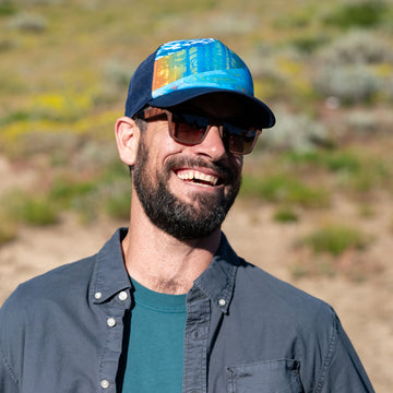 Man wearing a Sunday Afternoons Watershed Trucker