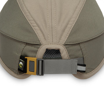 Close-up rear view of a beige and gray adjustable hat with a yellow buckle and a small black brand tag.